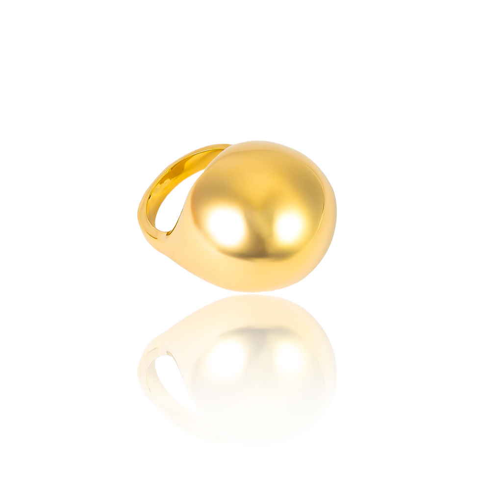 Gold plated oversized dome ring with smooth polished surface and sculptural design