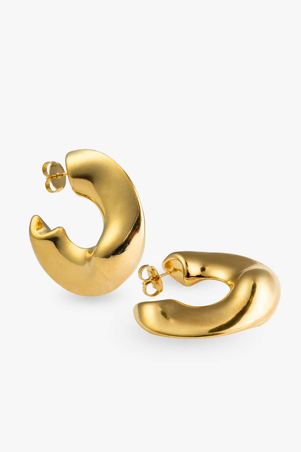 Curved gold statement hoop earrings angled view with post backs