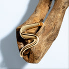 Gold sculptural cuff bracelet with S-shaped curves and 6mm thickness