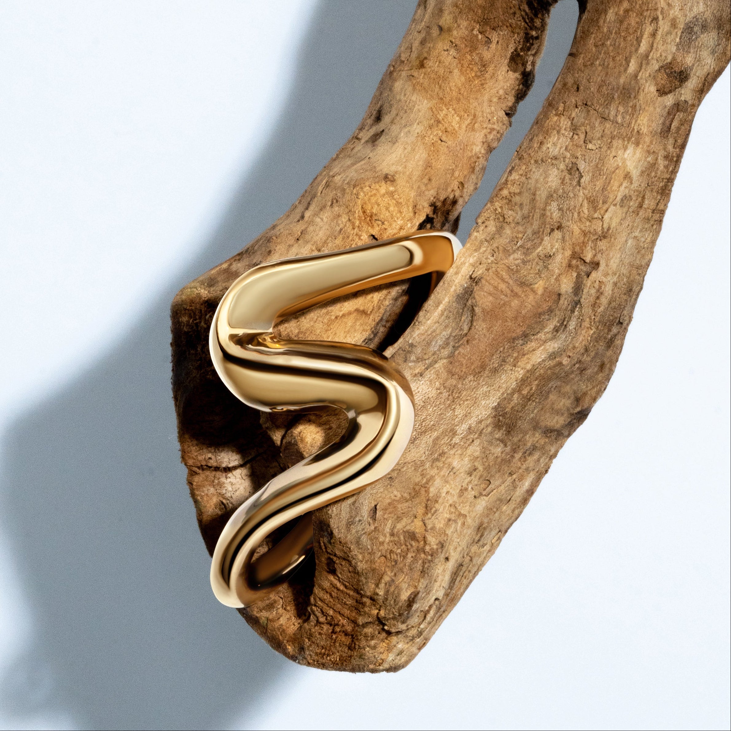 Gold sculptural cuff bracelet with S-shaped curves and 6mm thickness