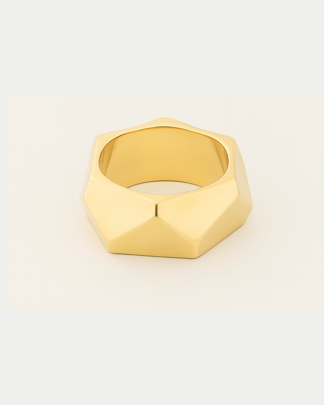 Gold plated wide sculptural bracelet with curved design and polished finish, 34mm
