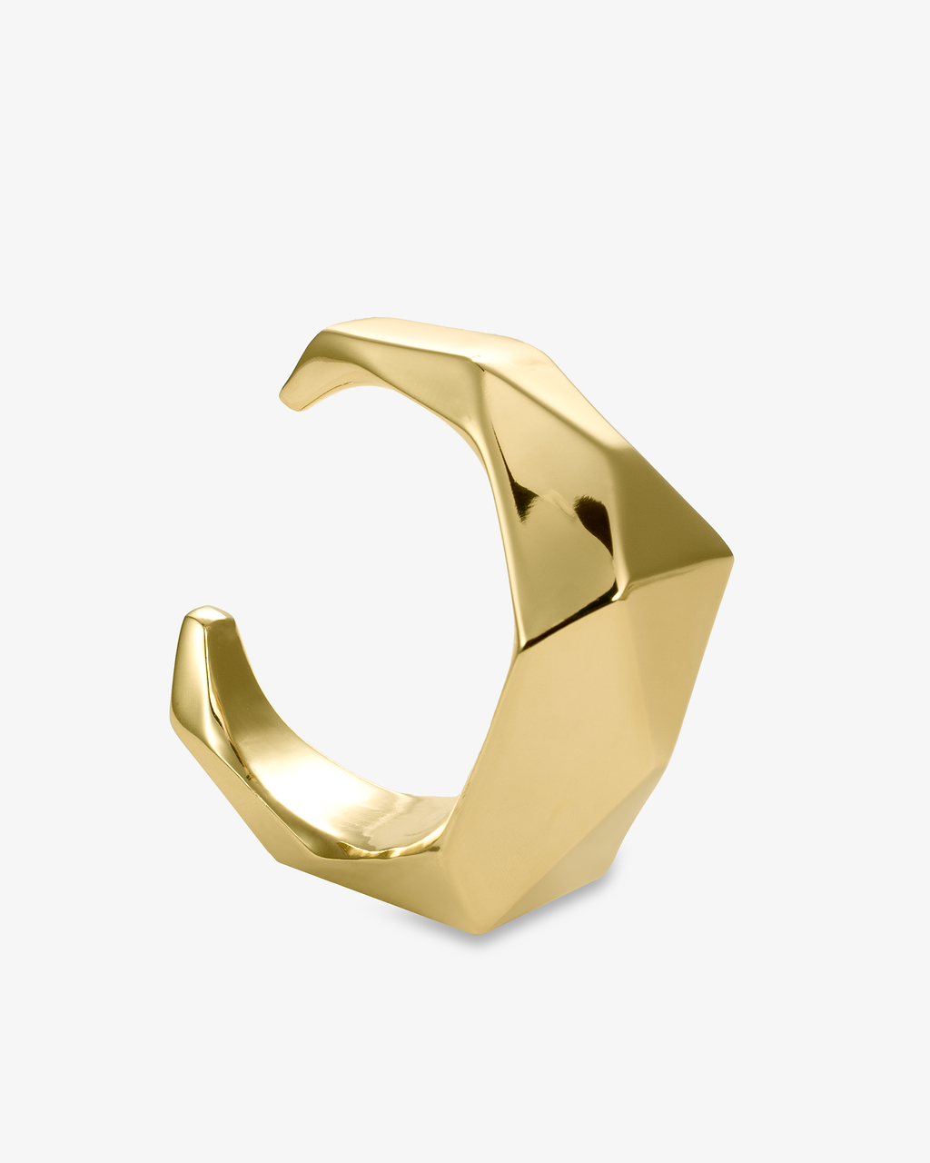 Gold sculptural geometric faceted cuff bracelet, alone product shot from a front-facing angle.