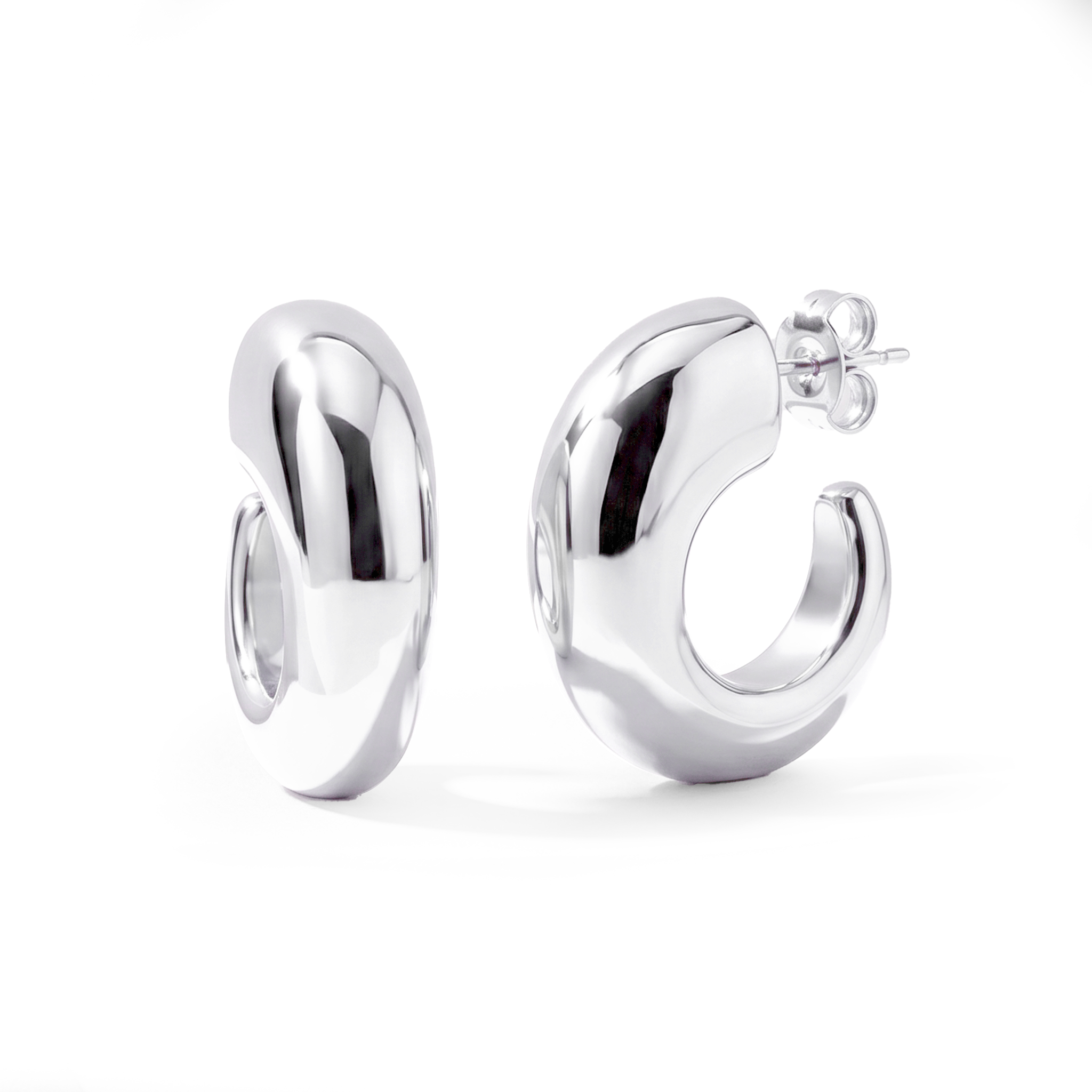 Oval open hoop earrings available in gold plated and rhodium plated finishes with sculptural thick design