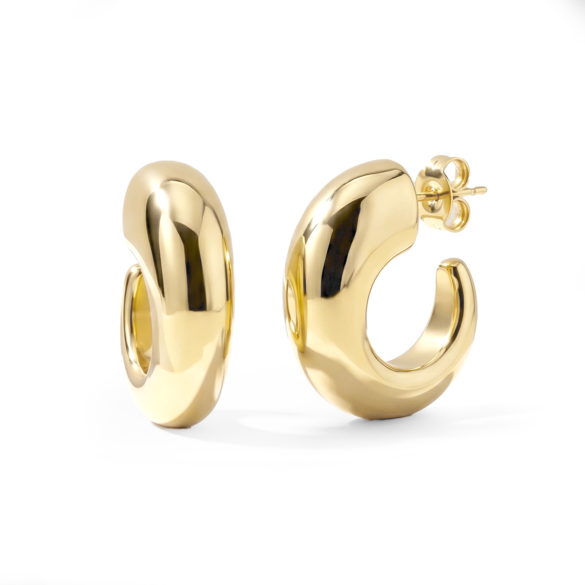 Oval open hoop earrings available in gold plated and rhodium plated finishes with sculptural thick design