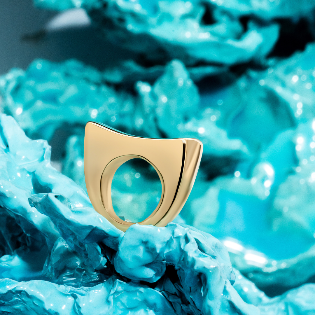 Gold sculptural bracelet with polished curved design and refined silhouette