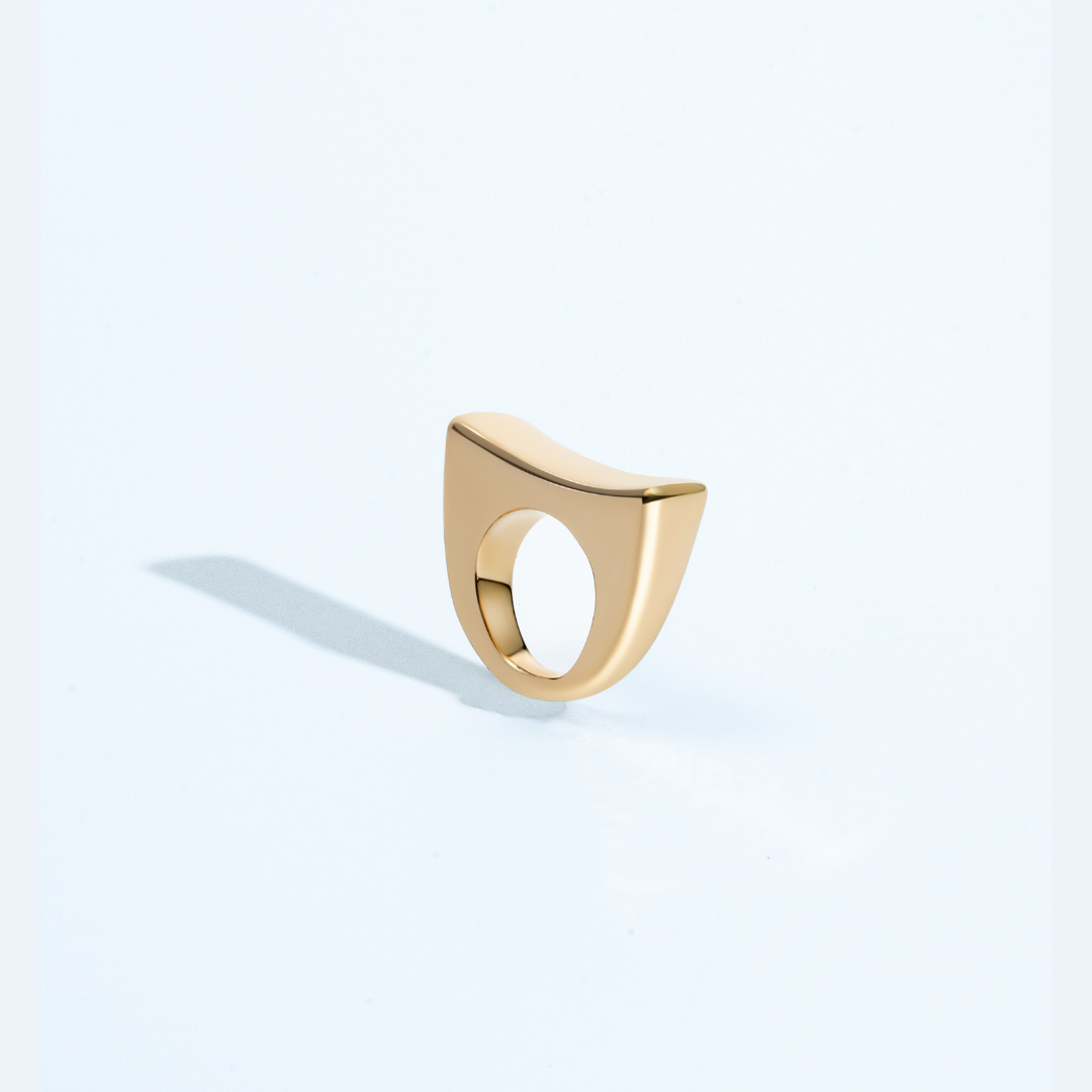 Gold sculptural bracelet with polished curved design and refined silhouette