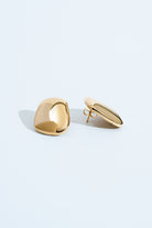 Gold geometric sculptural earrings with polished curved design