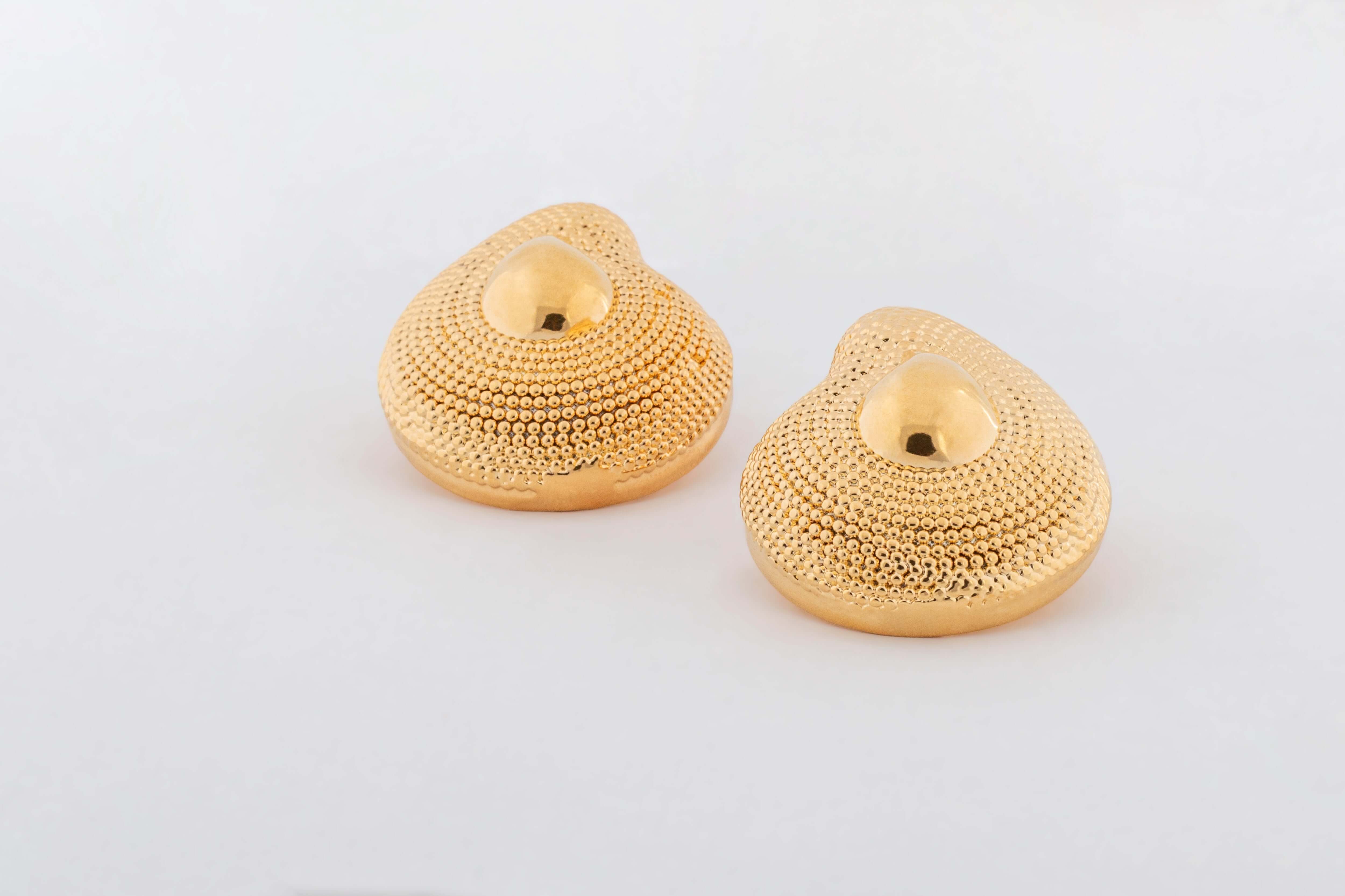 Gold plated textured dome earrings with rounded sculptural shape and asymmetric design, 40mm by 33mm