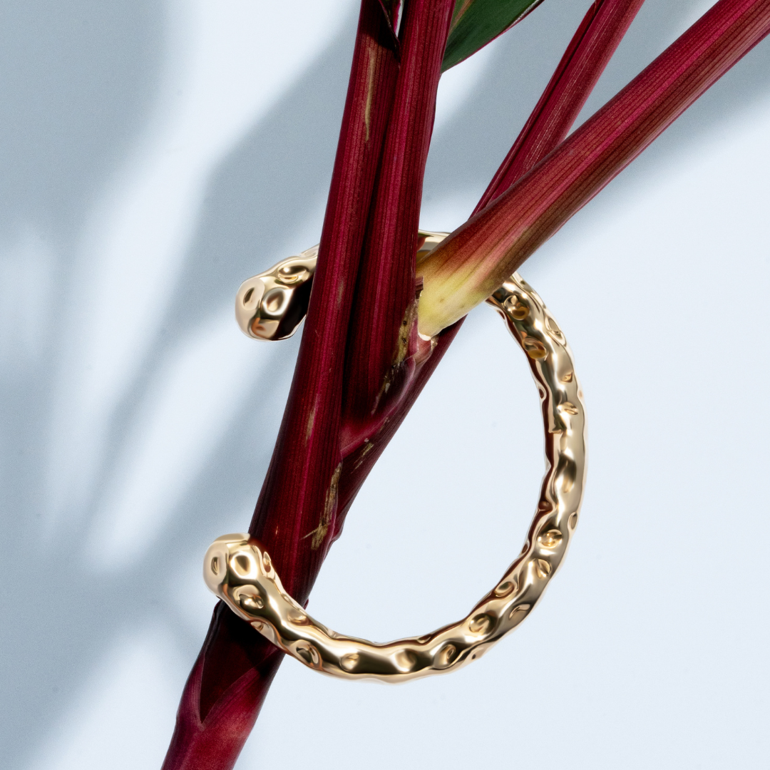 Gold molten textured cuff bracelet with organic sculptural design and 8mm thickness