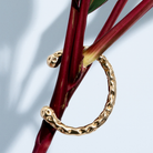Gold molten textured cuff bracelet with organic sculptural design and 8mm thickness
