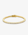 2mm gold tennis bracelet with round-cut clear stones and secure clasp