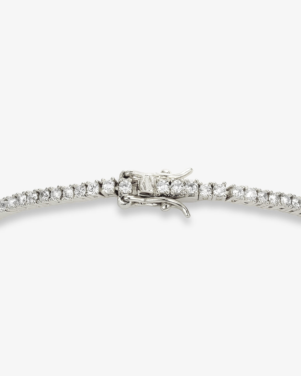 2mm silver tennis bracelet with round-cut clear stones and secure clasp