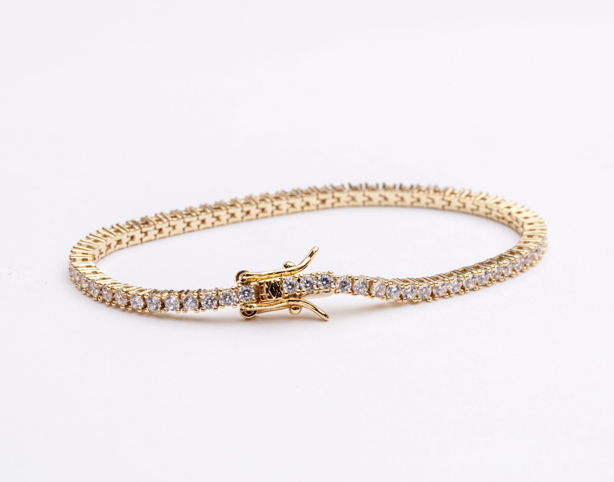Tennis necklace and bracelet set with cubic zirconia stones available in gold plated and rhodium finishes