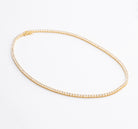 Tennis necklace and bracelet set with cubic zirconia stones available in gold plated and rhodium finishes