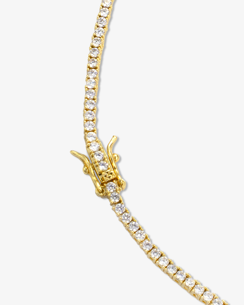 Gold tennis choker necklace close-up showing stone setting and clasp