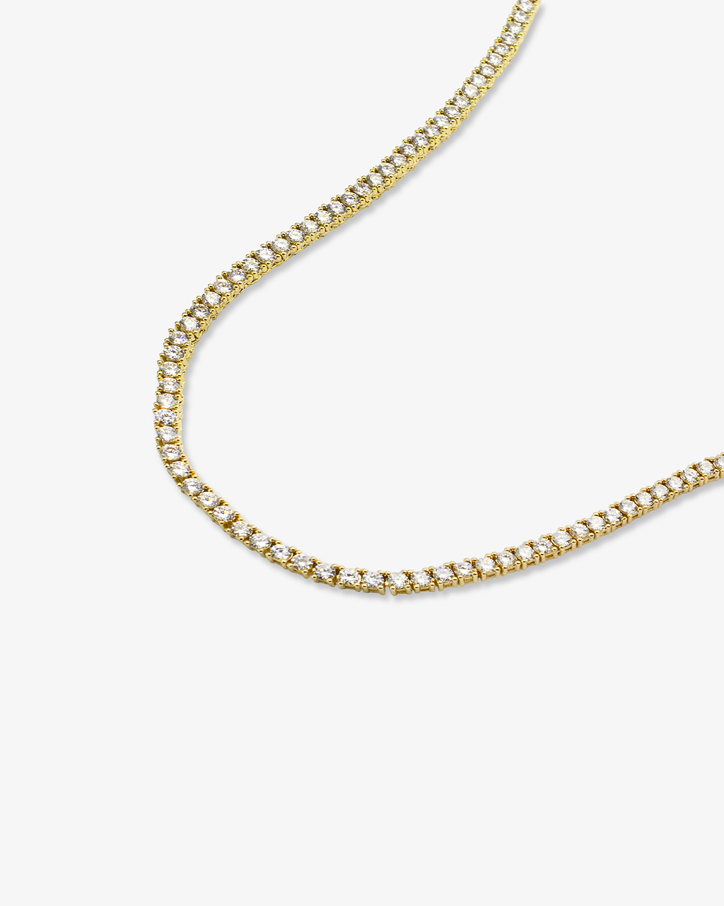 Gold tennis necklace with sparkling round clear stones angled view