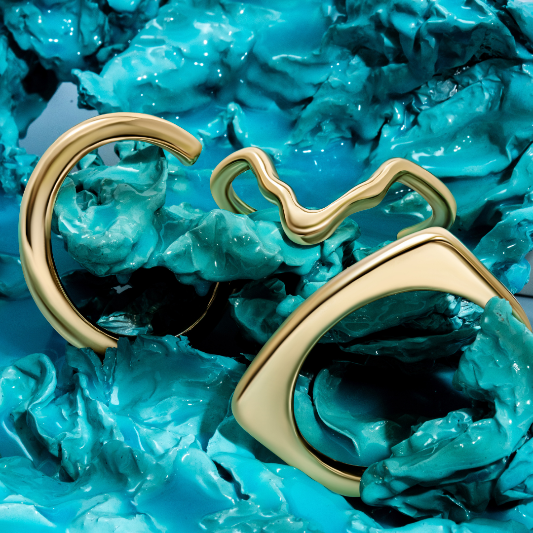 Gold sculptural bracelet with organic curved design and polished finish