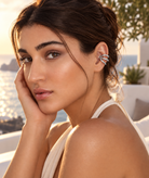 a model wearing a Sculptural triple loop gold ear cuff 