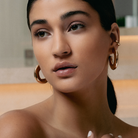 Hammered open hoop earrings available in gold plated and rhodium plated finishes with sculptural texture