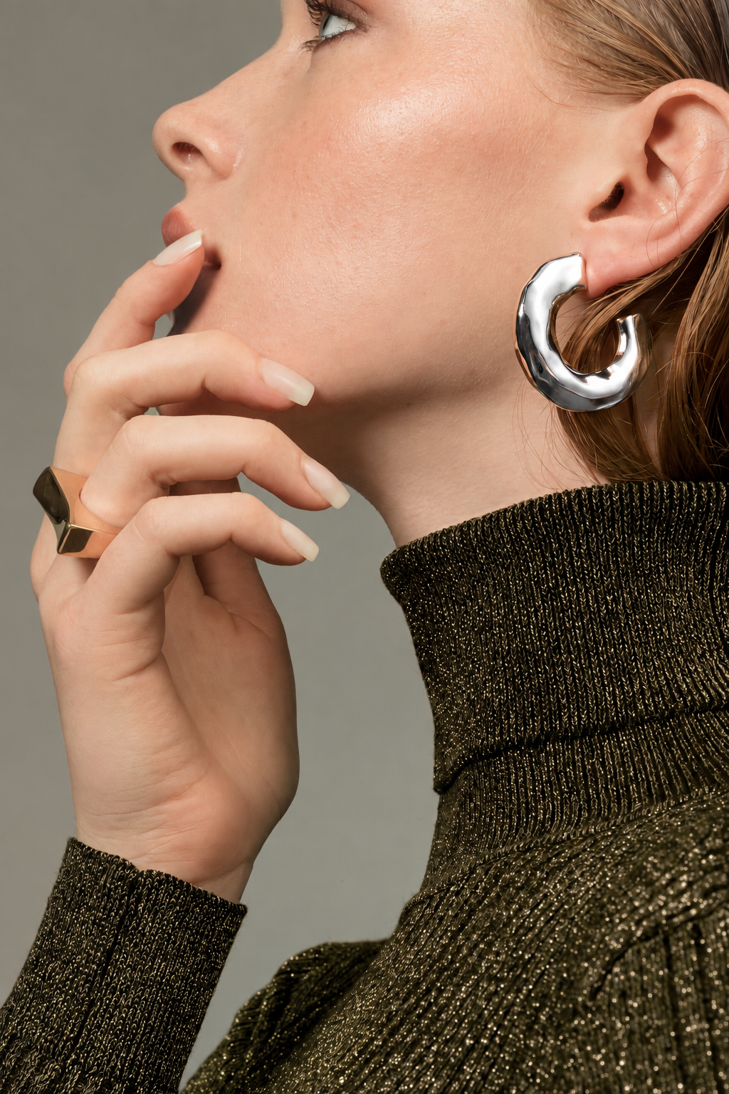a model wearing a Chunky organic silver hoop earrings