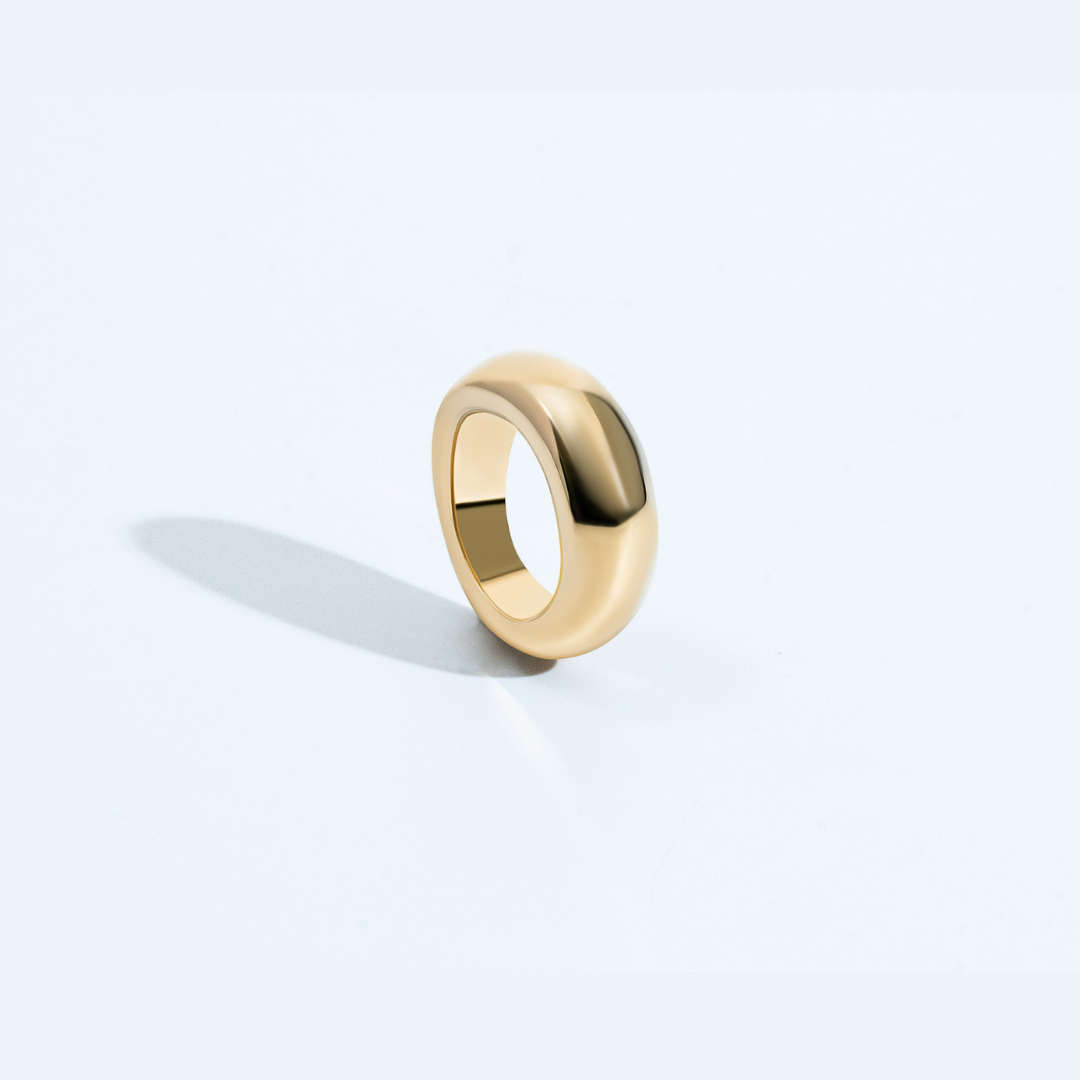 Gold rounded sculptural ring with chunky polished design