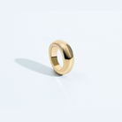 Gold rounded sculptural ring with chunky polished design