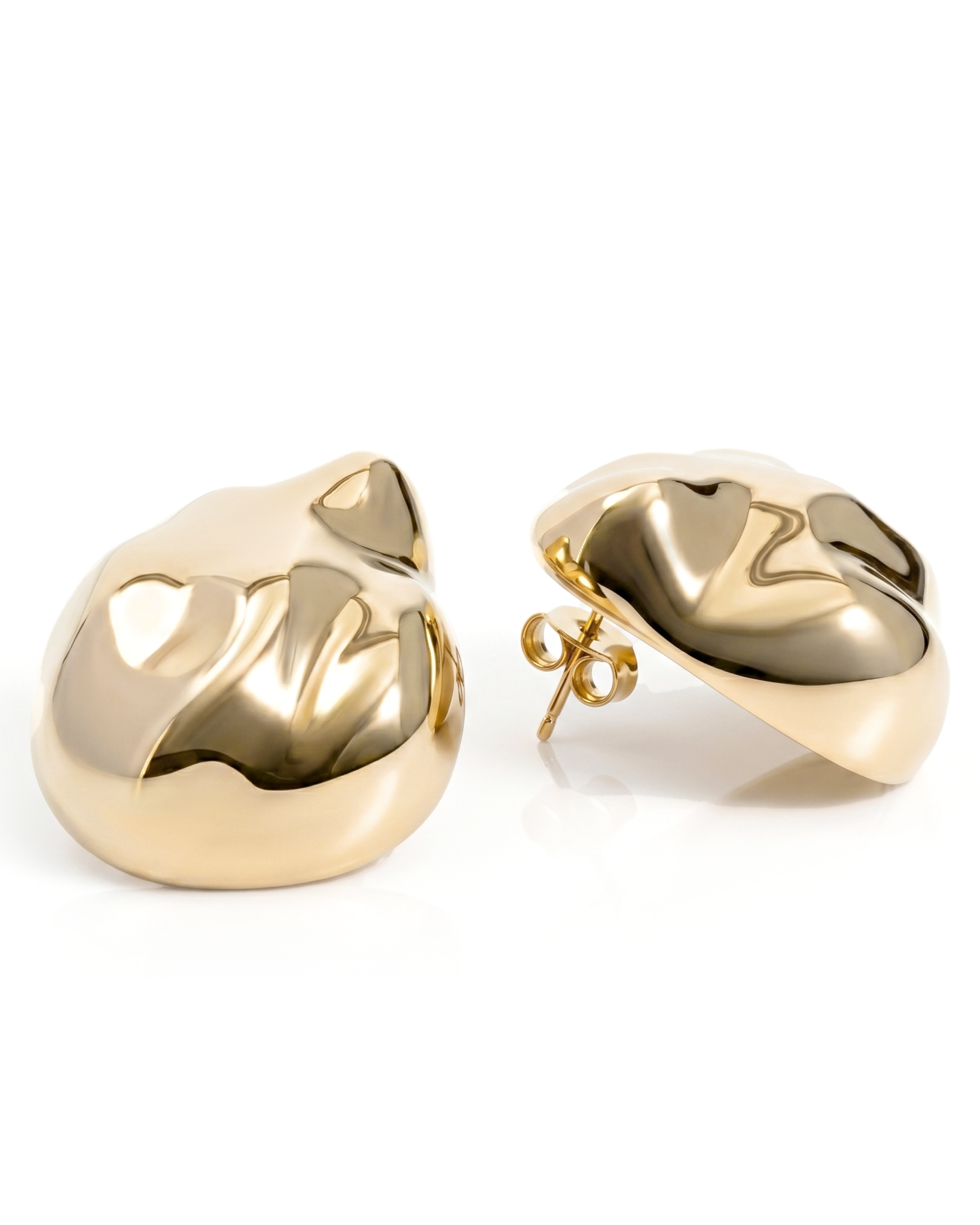 Dome earrings available in gold plated and rhodium plated finishes with dented sculptural texture