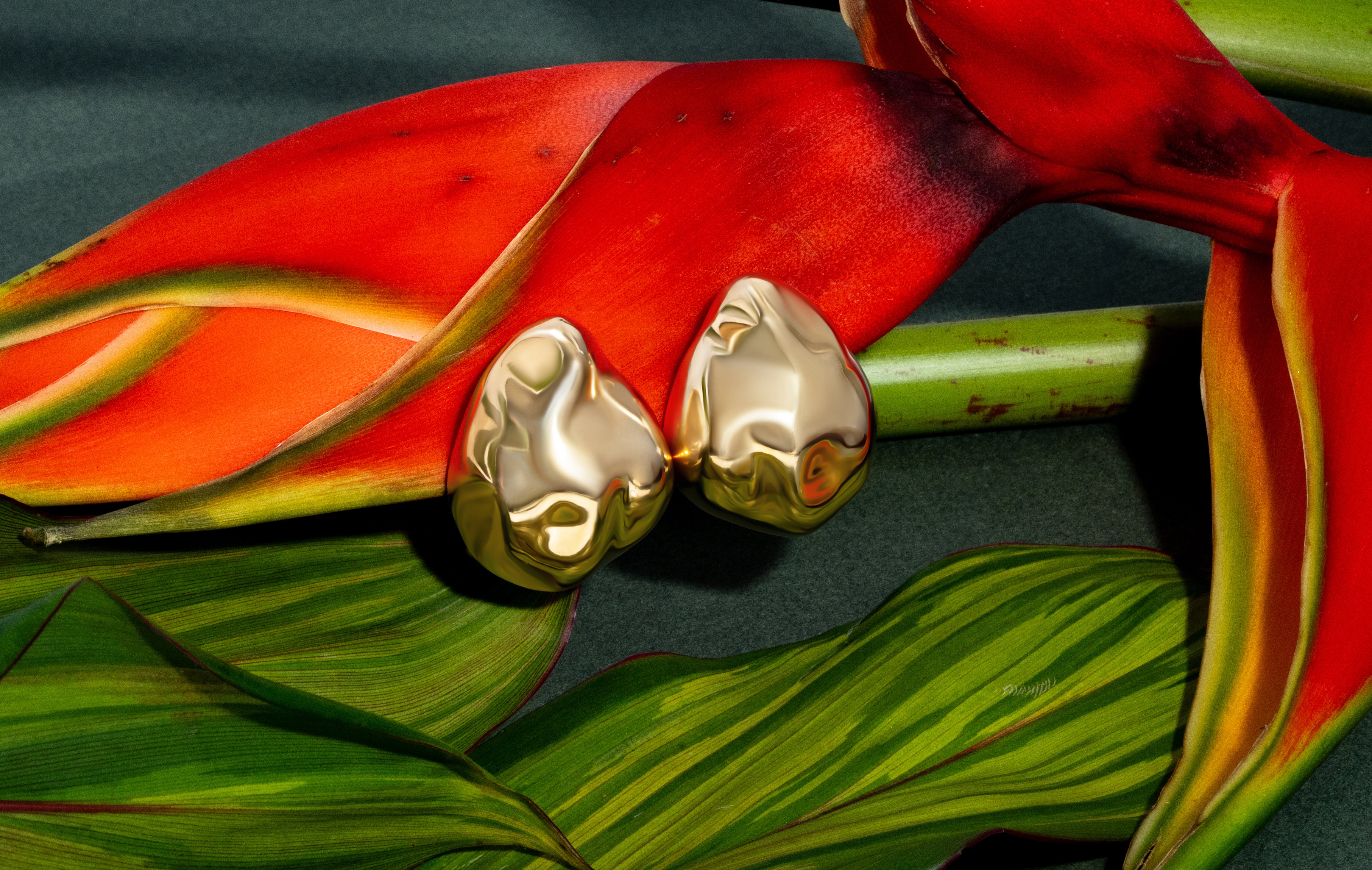 Dome earrings available in gold plated and rhodium plated finishes with dented sculptural texture