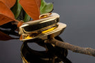 Gold plated wide cuff bracelet with open structured design and smooth polished surface, 40mm