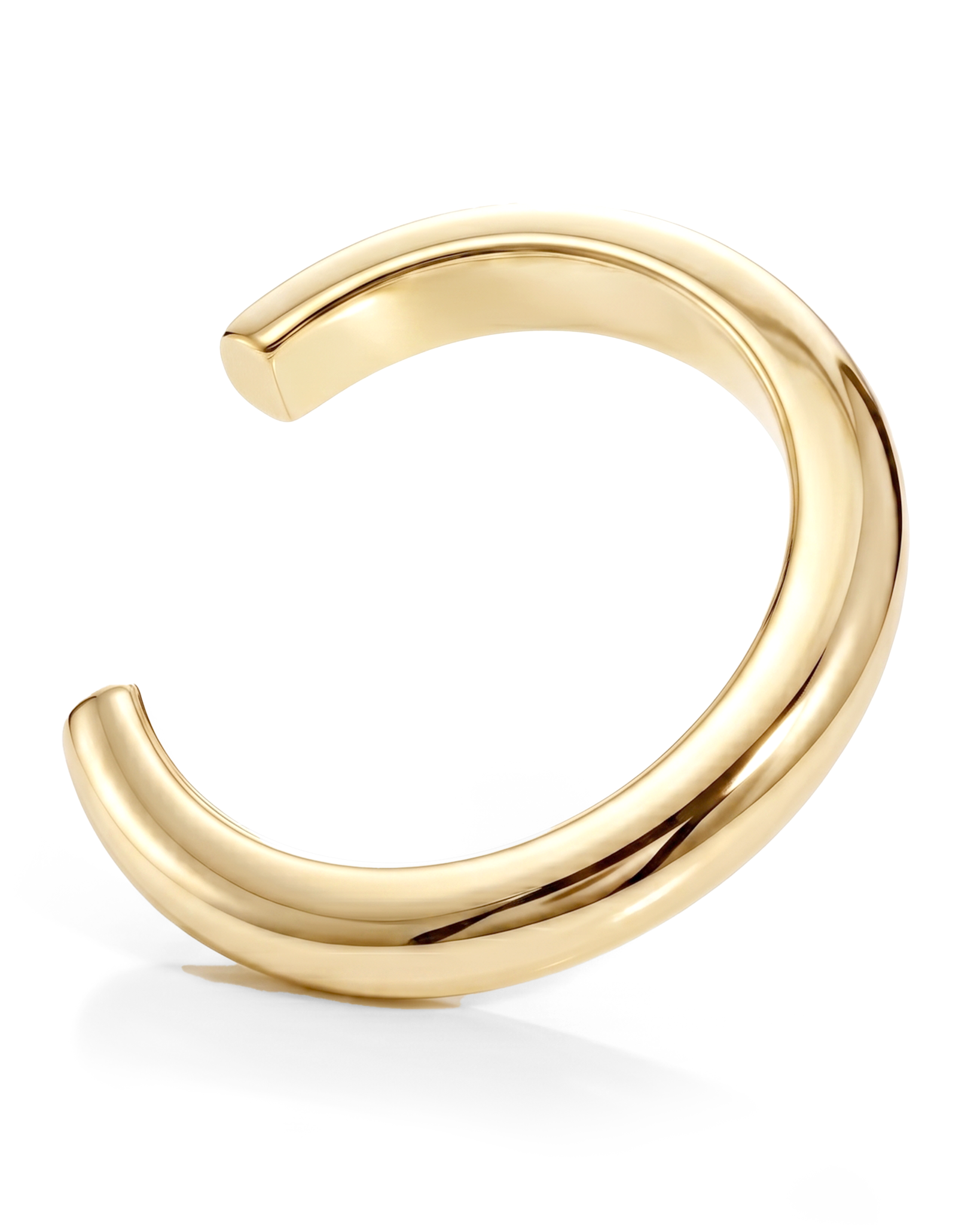 Sculptural cuff bracelet available in gold plated and rhodium plated finishes with bold circular design