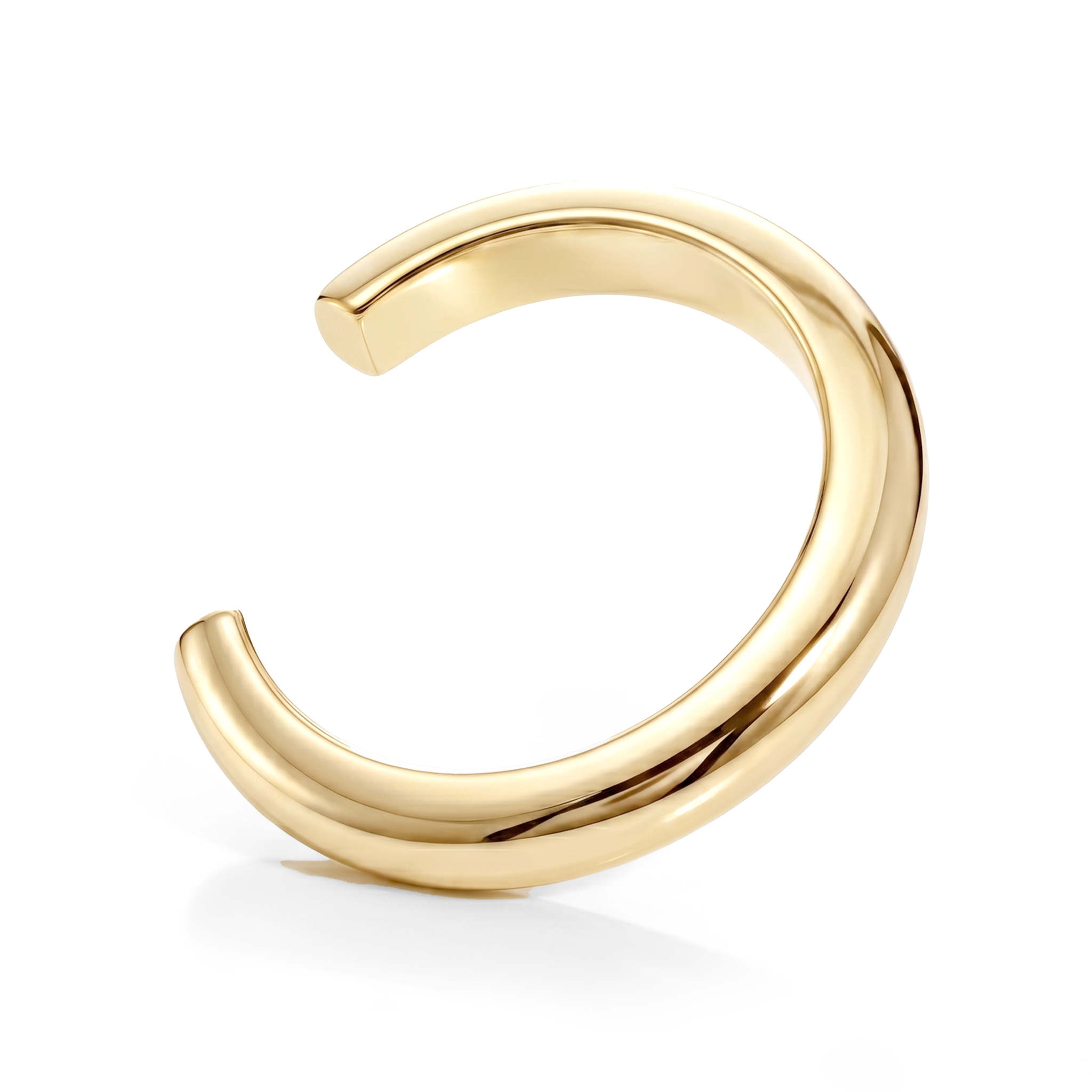 Sculptural cuff bracelet available in gold plated and rhodium plated finishes with bold circular design