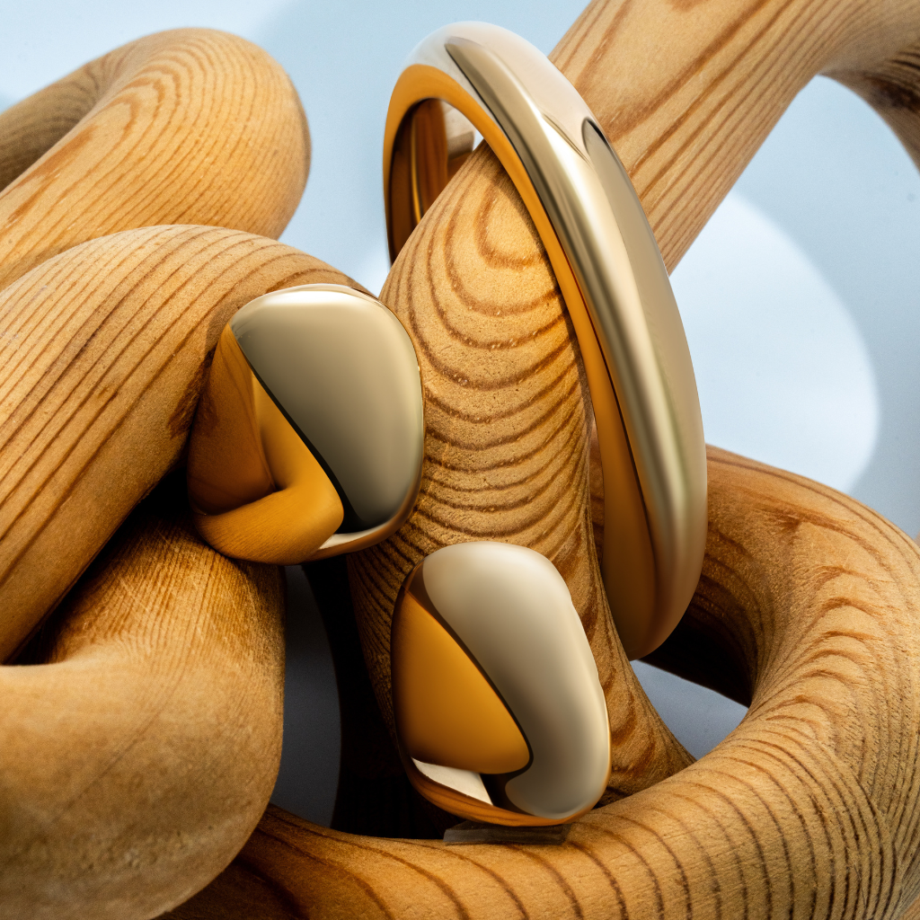 Sculptural cuff bracelet available in gold plated and rhodium plated finishes with bold circular design