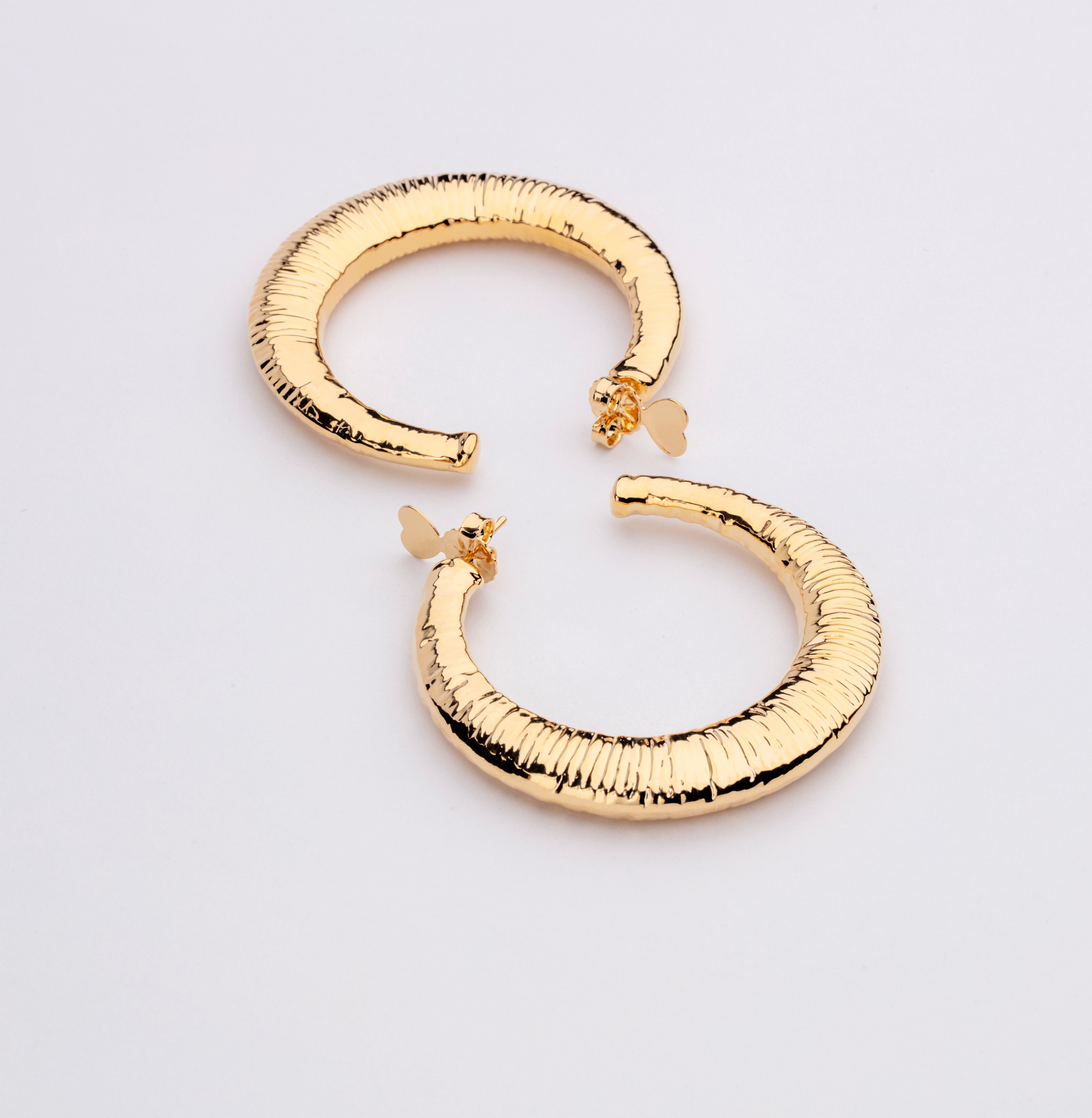 Gold plated open hoop earrings with subtle textured surface and lightweight design