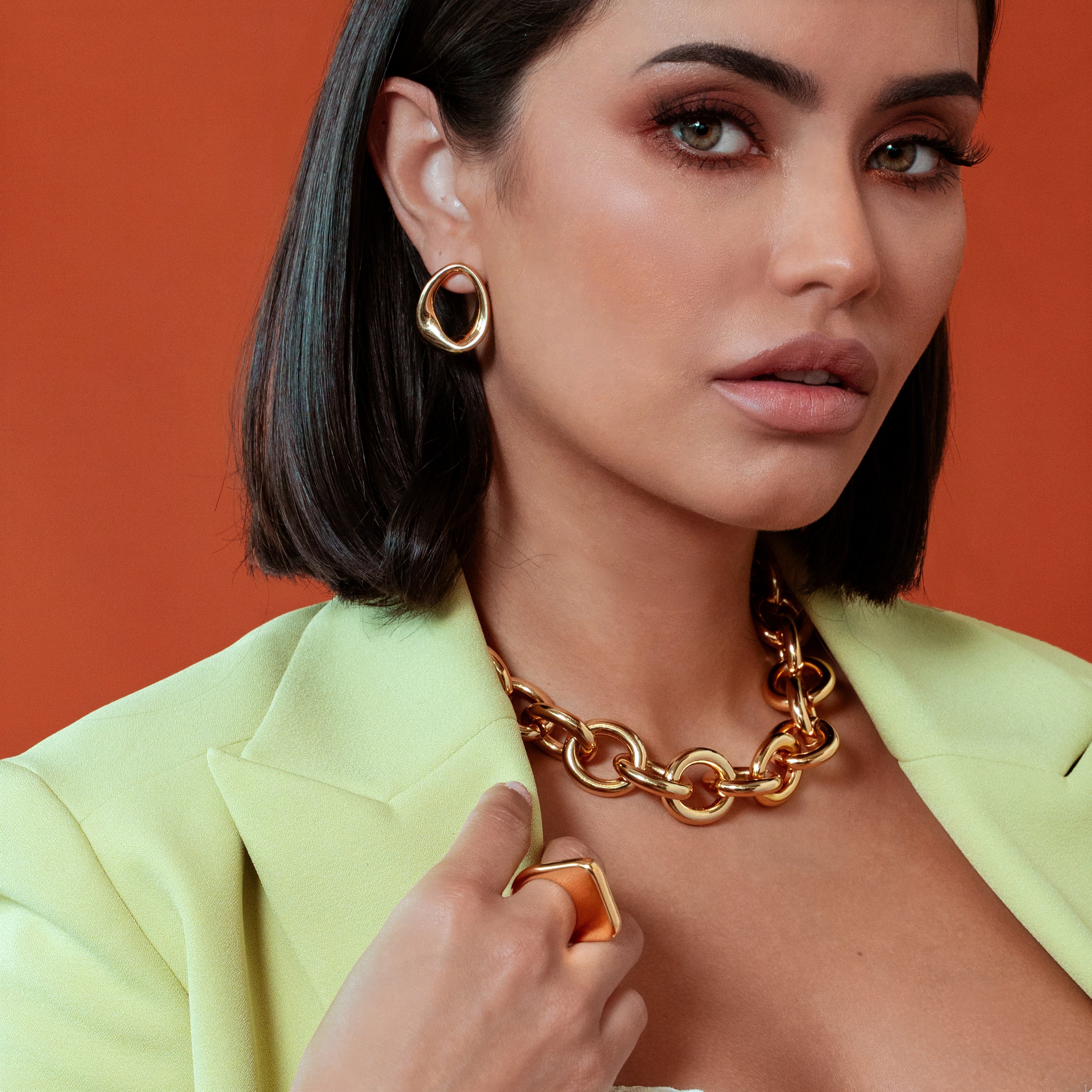 Abstract oval earrings available in gold plated and rhodium plated finishes with sculptural geometric design