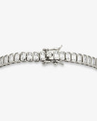 emerald-cut tennis bracelet featuring rectangular clear stones in polished silver settings