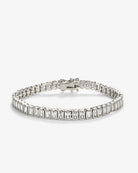 emerald-cut tennis bracelet featuring rectangular clear stones in polished silver settings