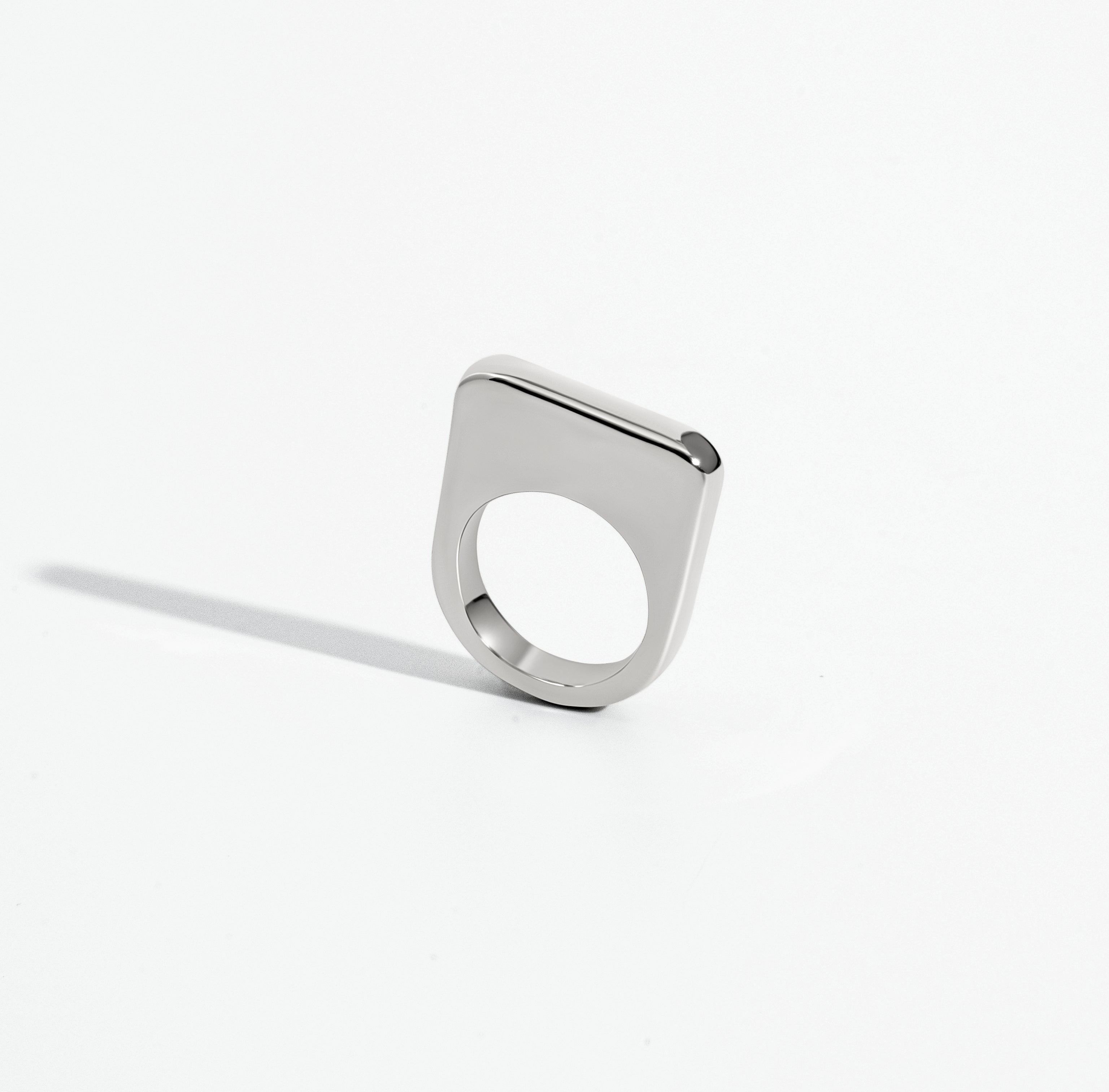 Geometric statement ring available in gold plated and rhodium plated finishes with sculptural square design