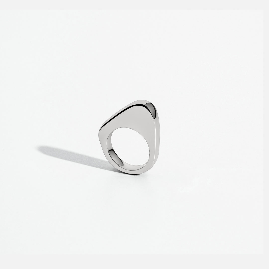 Asymmetric sculptural ring available in gold plated and rhodium plated finishes with moon-inspired shape