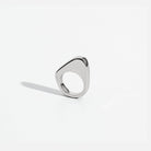 Asymmetric sculptural ring available in gold plated and rhodium plated finishes with moon-inspired shape