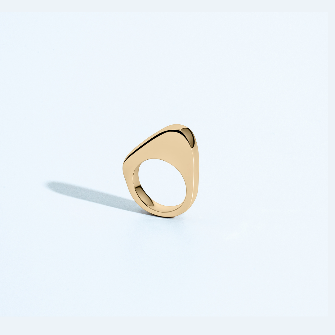 Asymmetric sculptural ring available in gold plated and rhodium plated finishes with moon-inspired shape