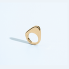 Asymmetric sculptural ring available in gold plated and rhodium plated finishes with moon-inspired shape