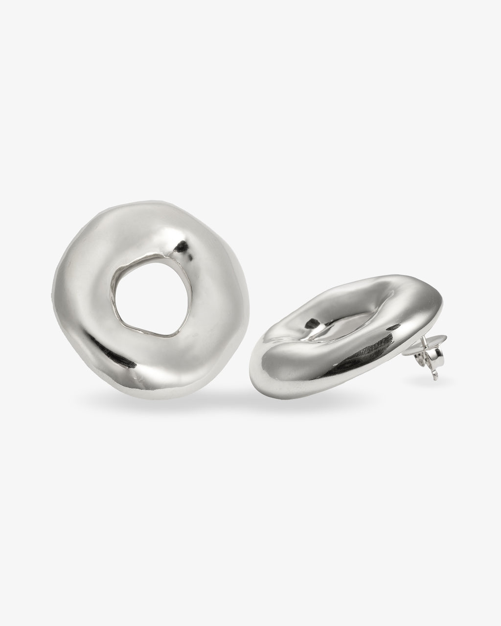 Sculptural donut-shaped silver earrings angled view with post backs