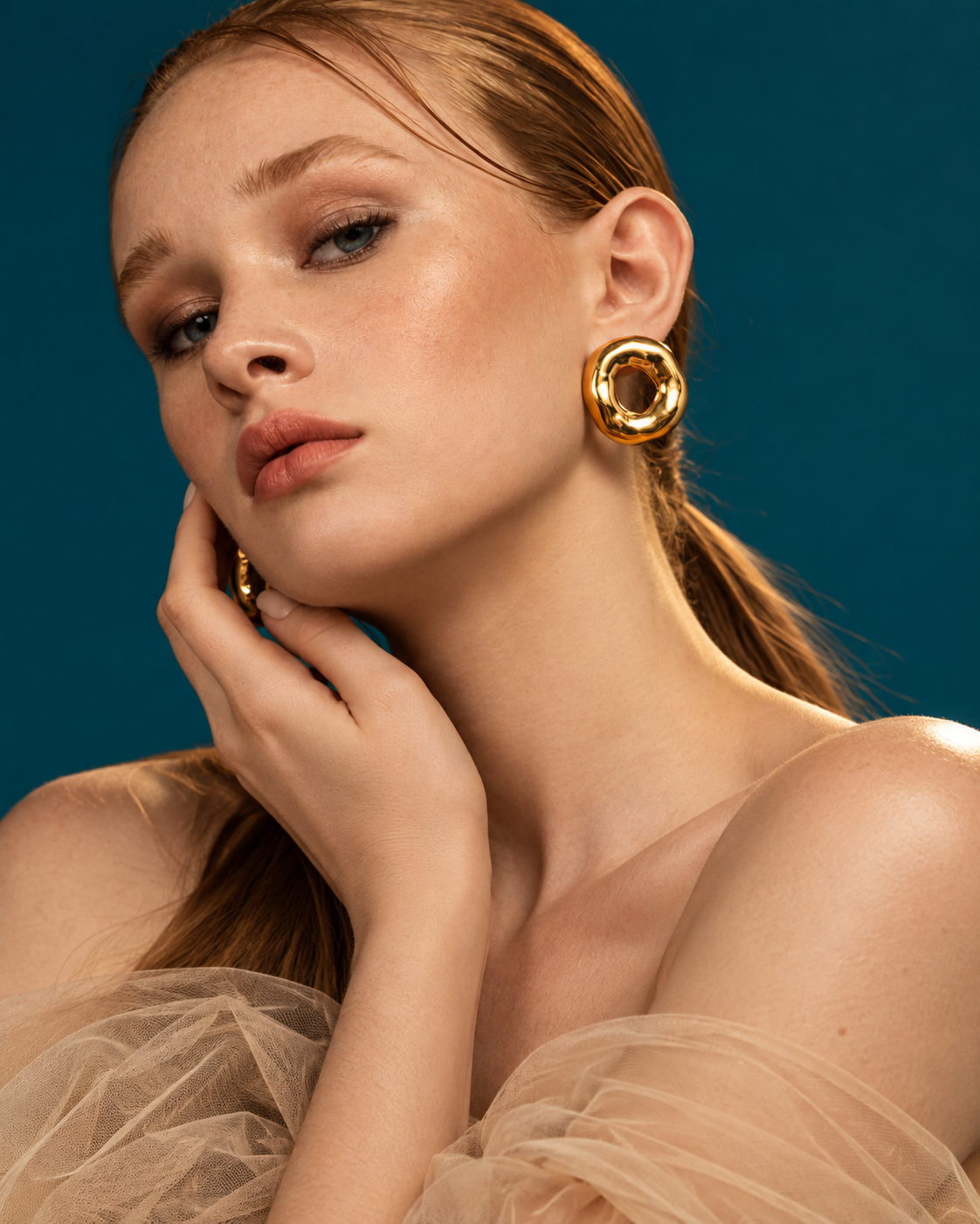 a lady wearing a Organic Donut Gold Statement Earrings
