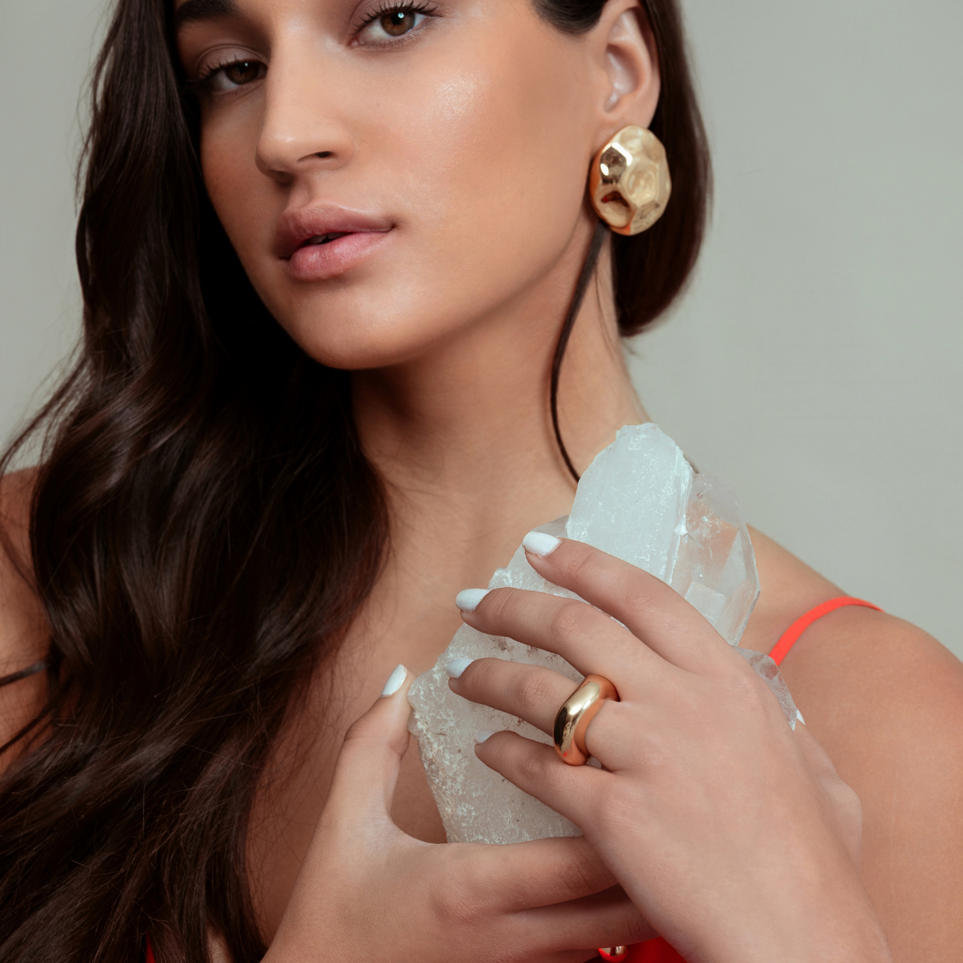 Gold dome earrings with organic sculptural shape and polished curved surface