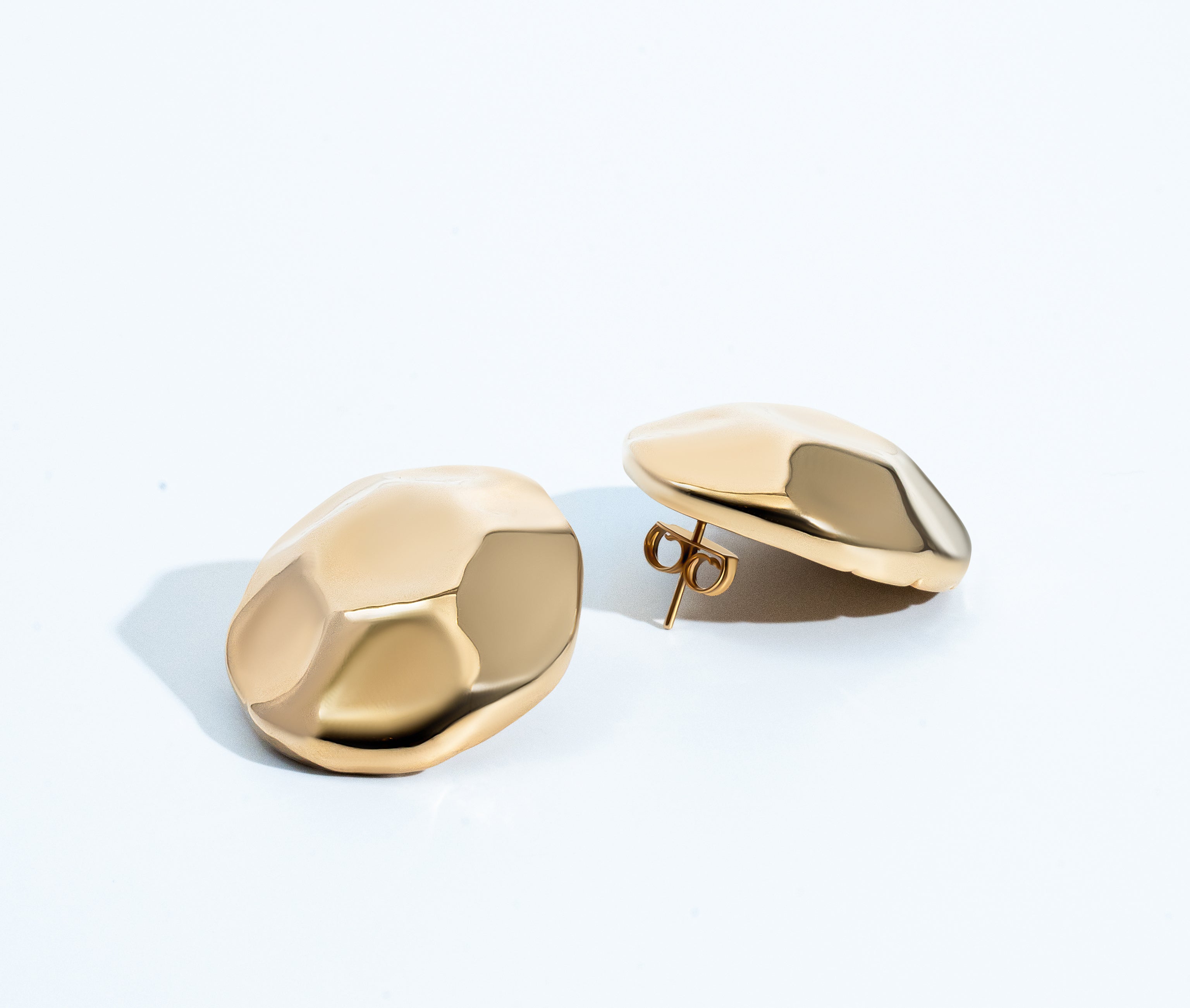 Gold dome earrings with organic sculptural shape and polished curved surface