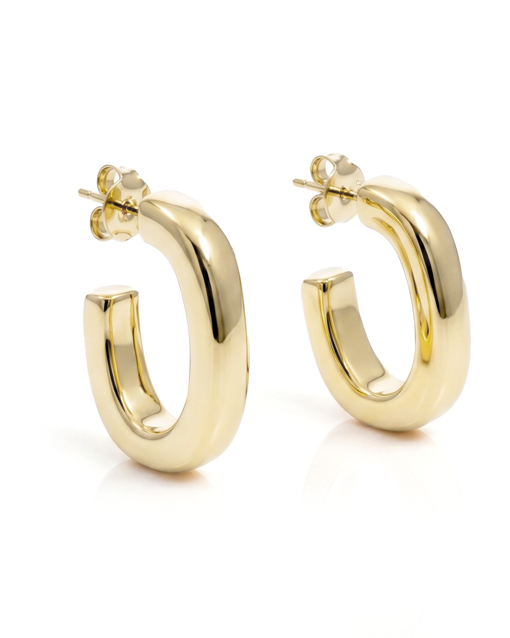 Oval open hoop earrings available in gold plated and rhodium plated finishes with sculptural curved design