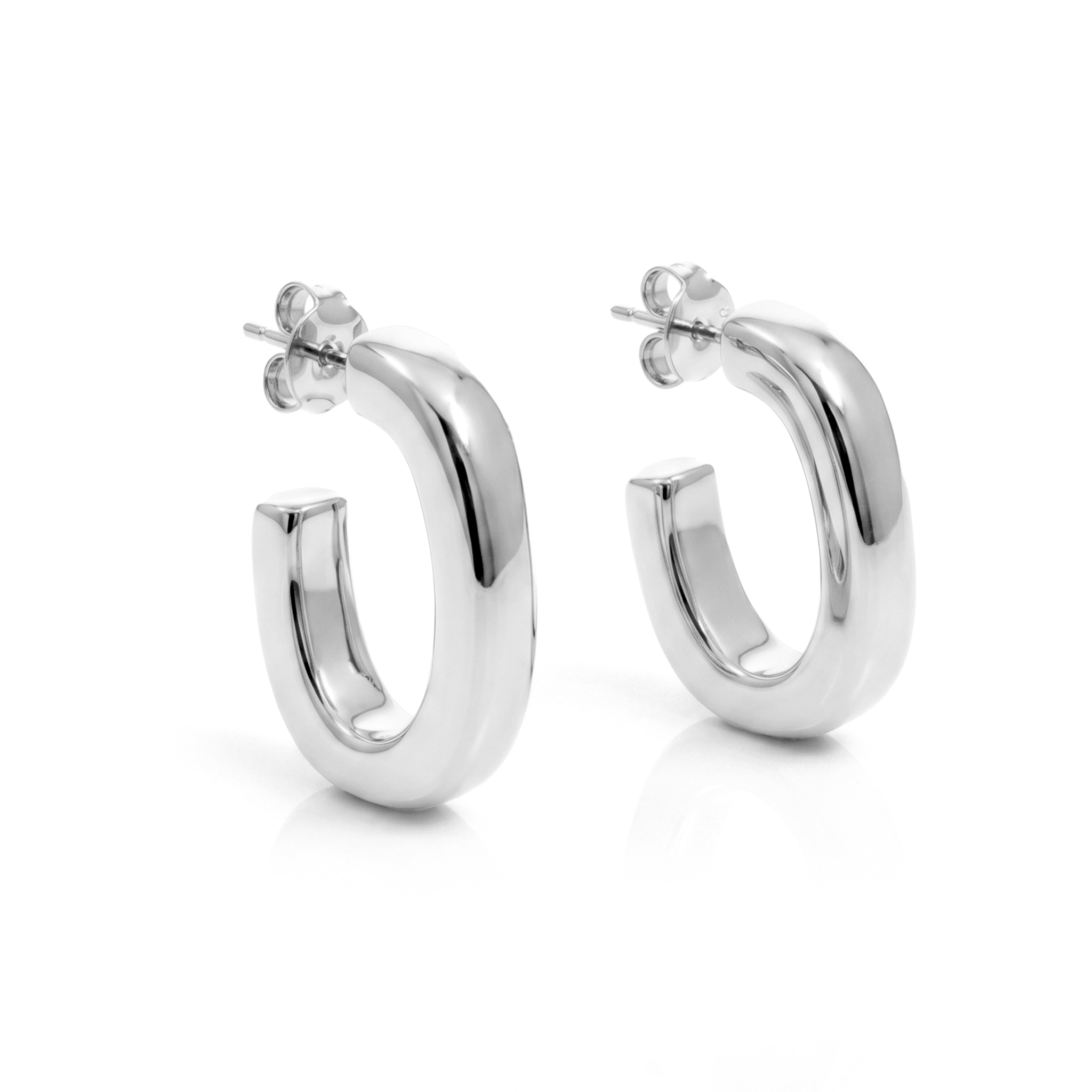 Oval open hoop earrings available in gold plated and rhodium plated finishes with sculptural curved design
