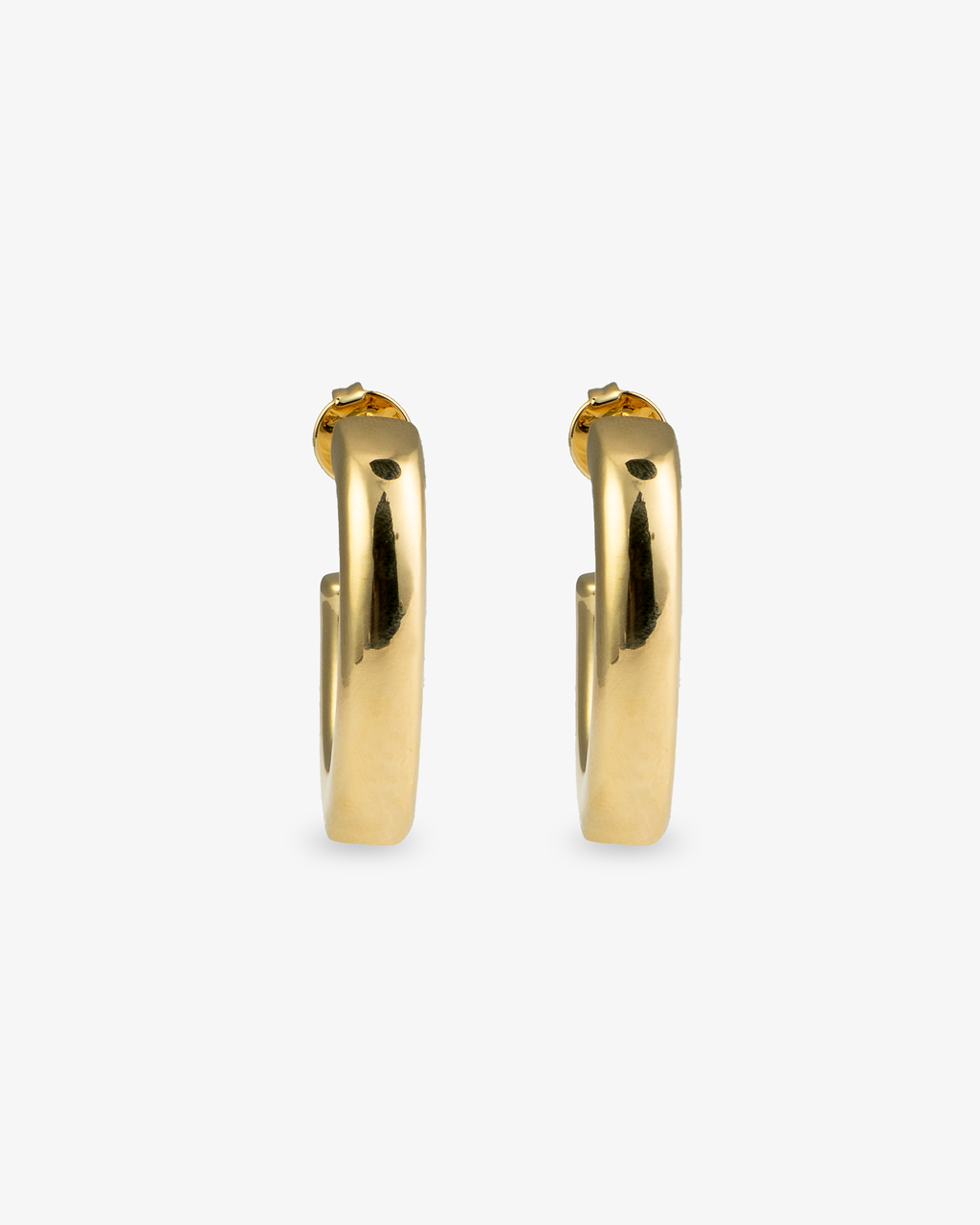 Chunky gold J-hoop earrings front view
