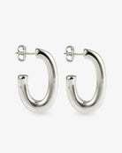 Chunky silver J-hoop earrings angled side view with post back