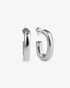 Chunky gold J-hoop earrings angled side view with post back
